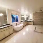 Modern bathroom remodeling project with walk-in shower and freestanding tub